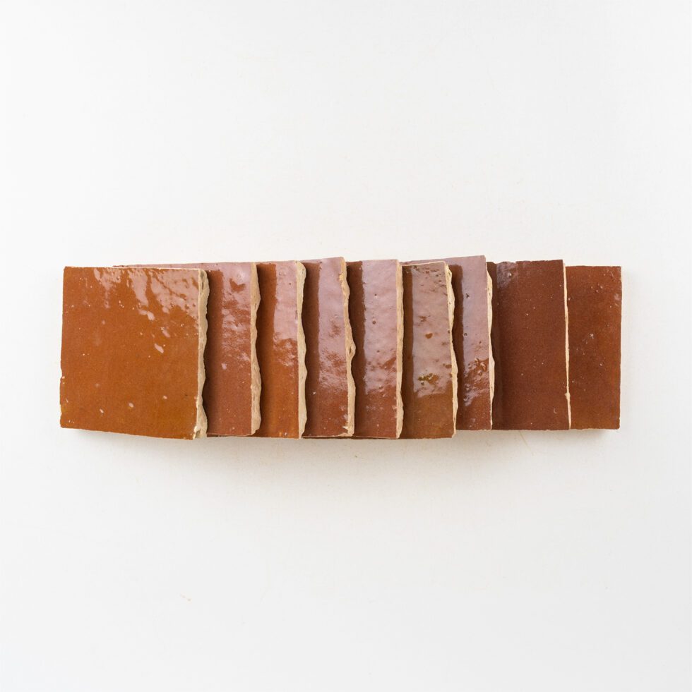 Rectangular bar of zellige tiles with layered texture on a white background