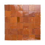 Square zellige tiles with a terracotta color pattern on a white background
