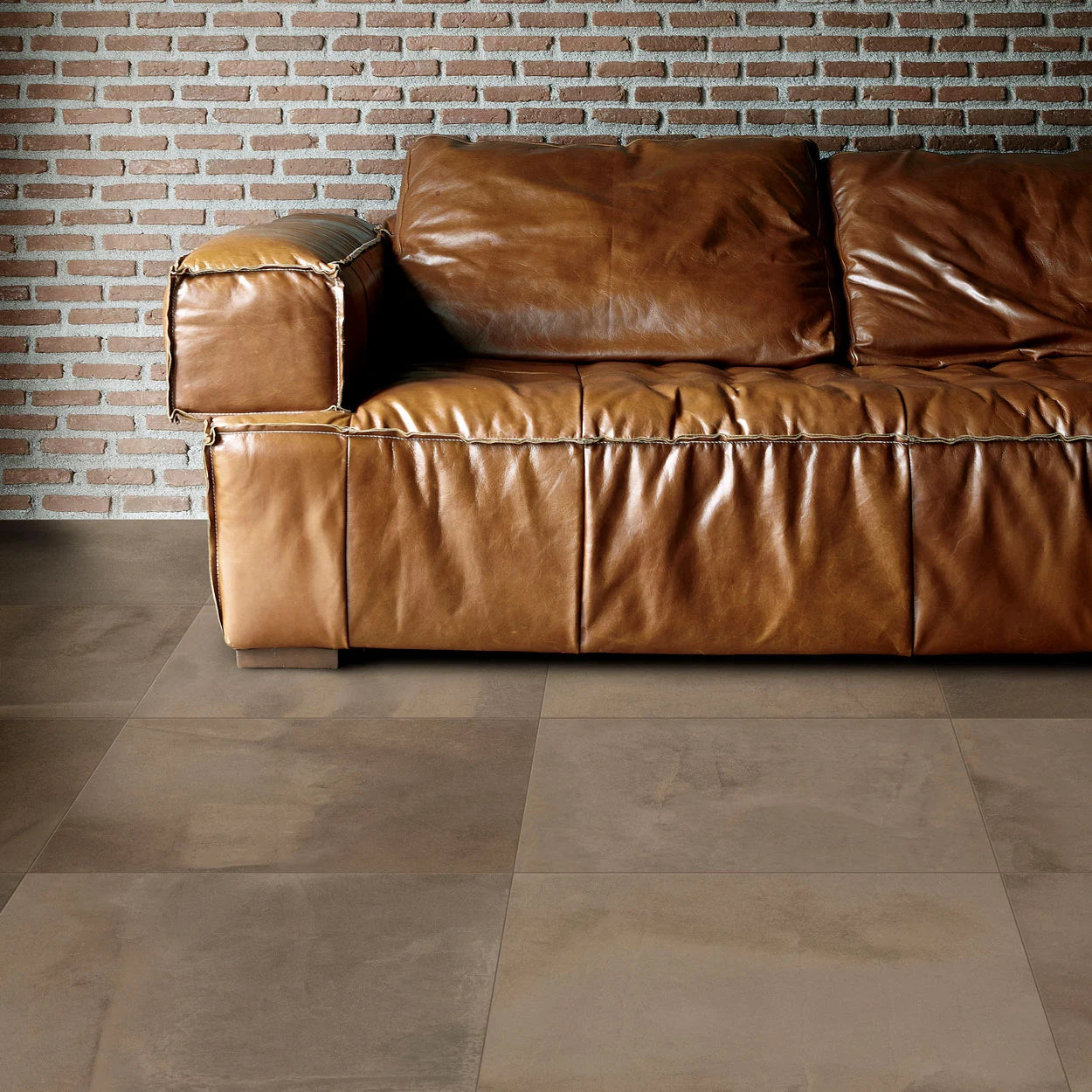 Textura 24x24 tile with a stamped concrete texture, perfect for luxury interiors.