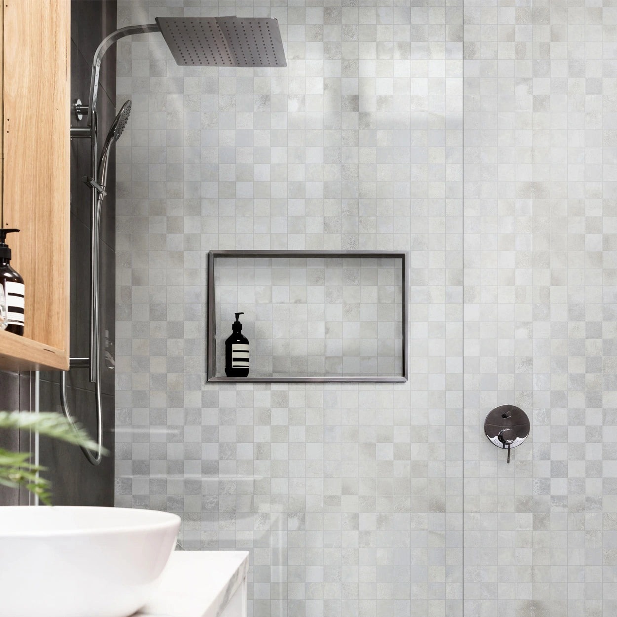 Textura 2x2 mosaic tile sheet with stamped concrete texture for walls and shower floors.