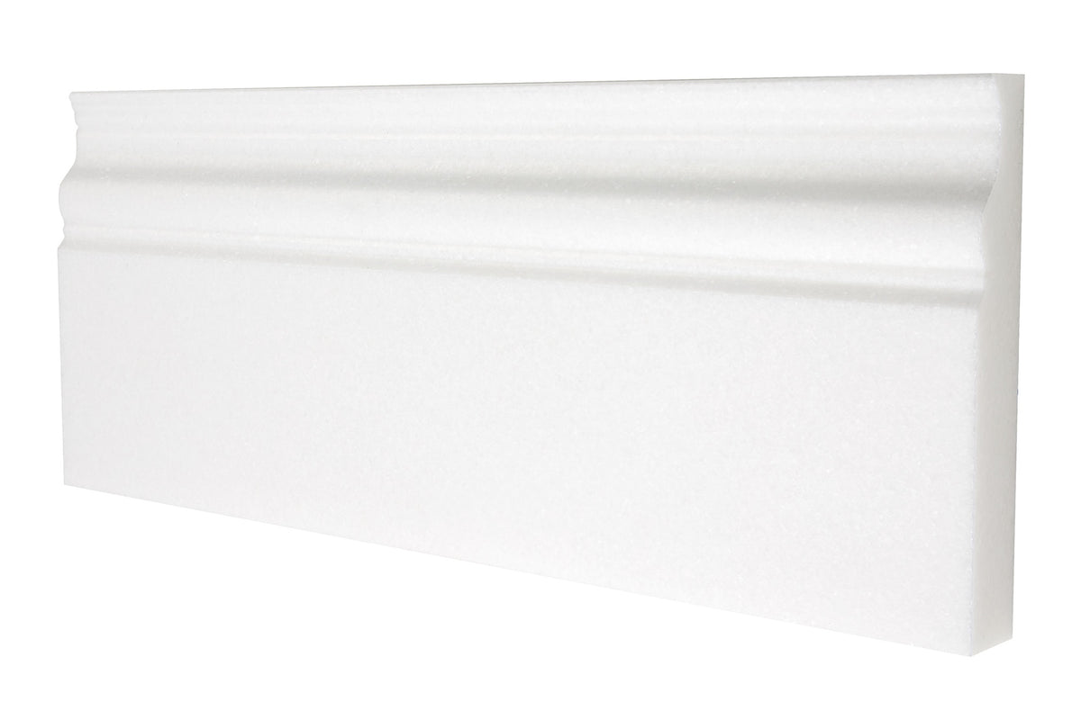 White Thassos marble 4¾×12 baseboard trim in polished and honed finishes, bright pure white.