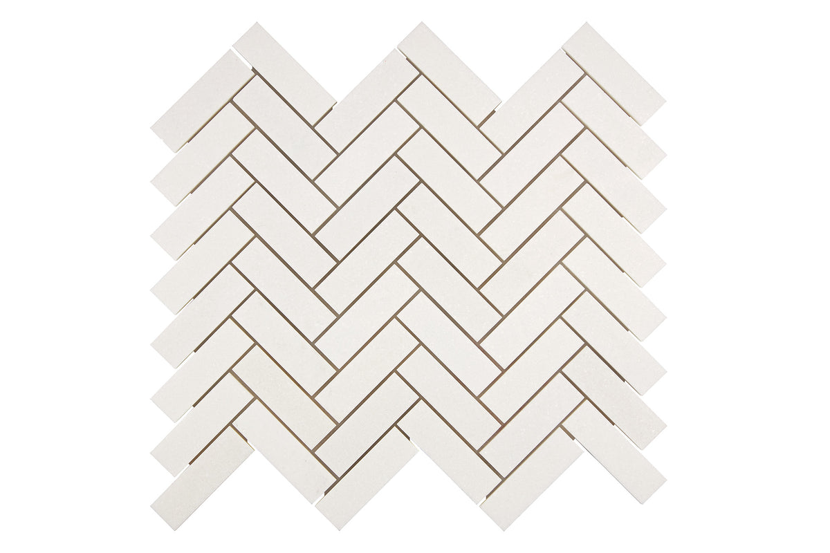 White Thassos marble 1×3 herringbone mosaic sheet in polished and honed finishes, bright pure white.