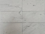 3x6 White Carrara marble tiles showcasing natural veining, perfect for backsplashes, bathroom walls, and other elegant spaces.