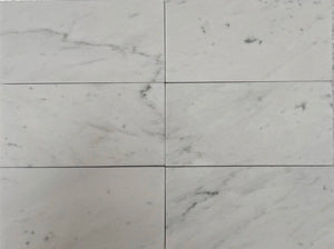 Carrara White Gioia marble 3×6 subway tile with a polished finish.