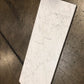 White Carrara Gioia 18x36 marble tiles dry-lay displayed for quality inspection