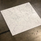 White Carrara Gioia 18x36 marble tiles dry-lay displayed for designer inspection on a custom floor