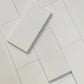 White Thassos marble subway tile in a 3x6 size, showcasing its smooth and flawless white finish, ideal for backsplashes and modern wall designs.