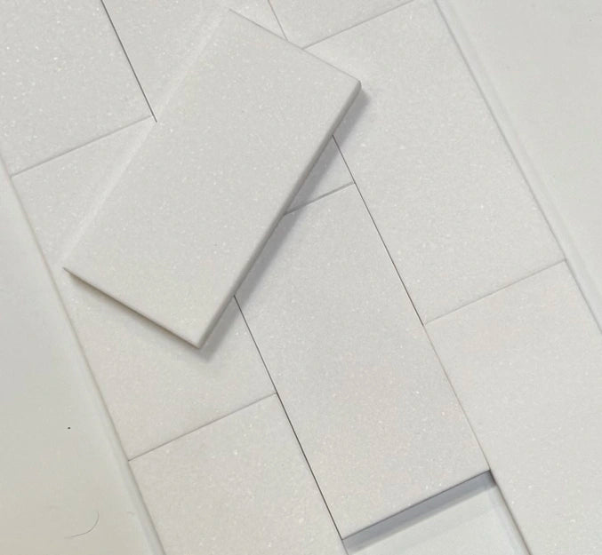 White Thassos marble subway tile in a 3x6 size, showcasing its smooth and flawless white finish, ideal for backsplashes and modern wall designs.
