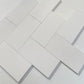 Elegant 3x6 White Thassos marble tiles arranged in a classic subway pattern, perfect for upscale interior design projects.