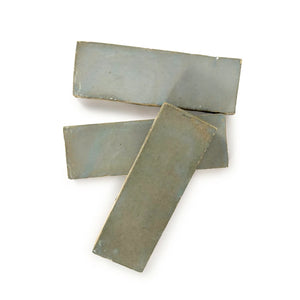 Marrakech Gray glossy handmade Moroccan Zellige 2×6 rectangular wall tile in a stacked layout.