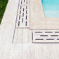 SeraPool Relax porcelain flexible drain grate and corner detail installed beside pool coping