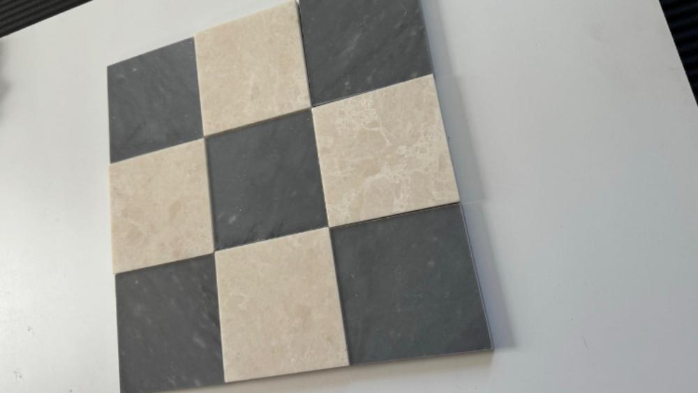 Bardiglio Imperial blue marble and creamy beige marble tiles in a checkerboard pattern, accented by deep red marble and white marble pieces. The rich color palette adds contrast and luxury to any space.