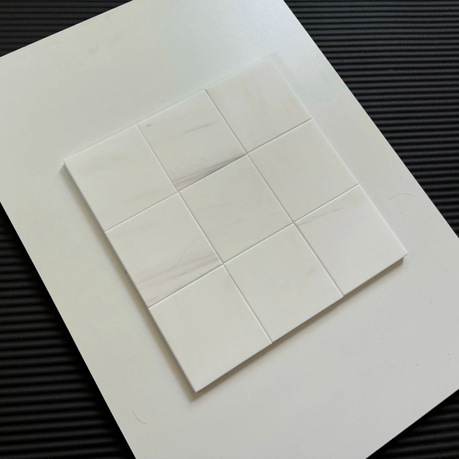 A high-end checkerboard tile arrangement featuring Bianco Dolomite  tiles, perfect for a classic yet modern interior. The elegant texture and color palette make it ideal for floors or walls.