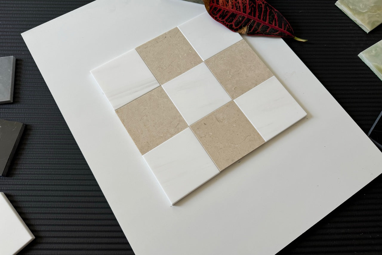 A detailed arrangement of Crema Marfil and Bianco Dolomite tiles, highlighting their natural textures and neutral tones, ideal for luxurious bathroom or kitchen tiling projects.
