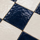 Close-up detail of Camille Checkerboard Zellige Tile highlighting handmade texture, glaze variation, and artisan craftsmanship.