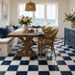 Camille Checkerboard Zellige Tile installed in a bright coastal kitchen featuring Indigo and Ivory handcrafted Moroccan Zellige.