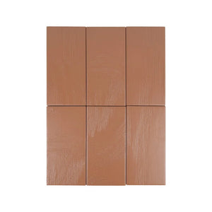 Stria Clay Terracotta 3.5×7 porcelain tiles arranged to show color and texture variation.