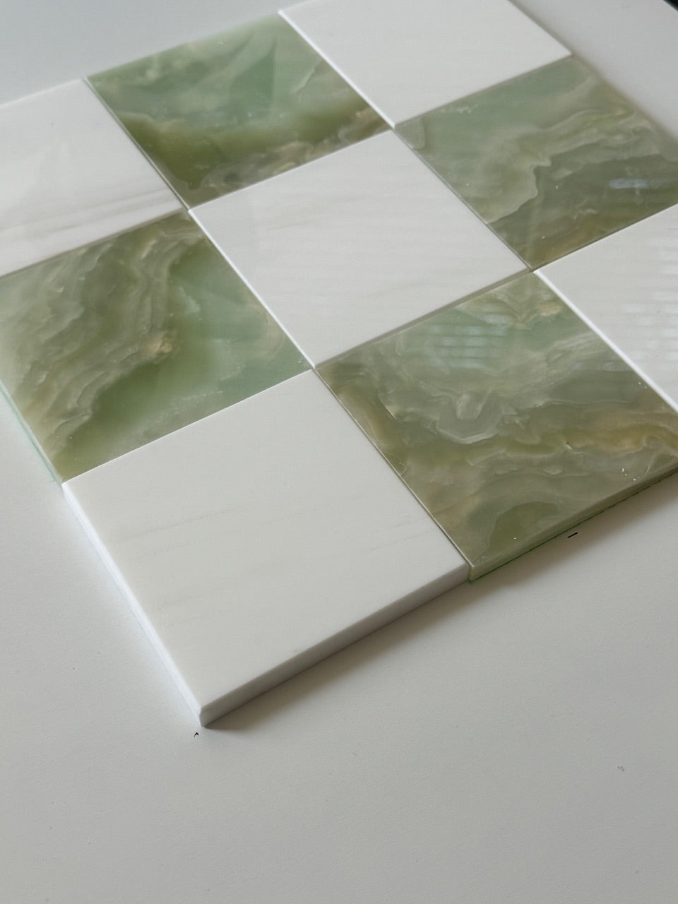 Close-up of a checkerboard tile design featuring Bianco Dolomite white marble and translucent Green Onyx. The natural veining in the Green Onyx tiles contrasts beautifully with the clean, polished white marble, perfect for modern wall tiles or kitchen backsplashes. Natural stone elegance at its finest.