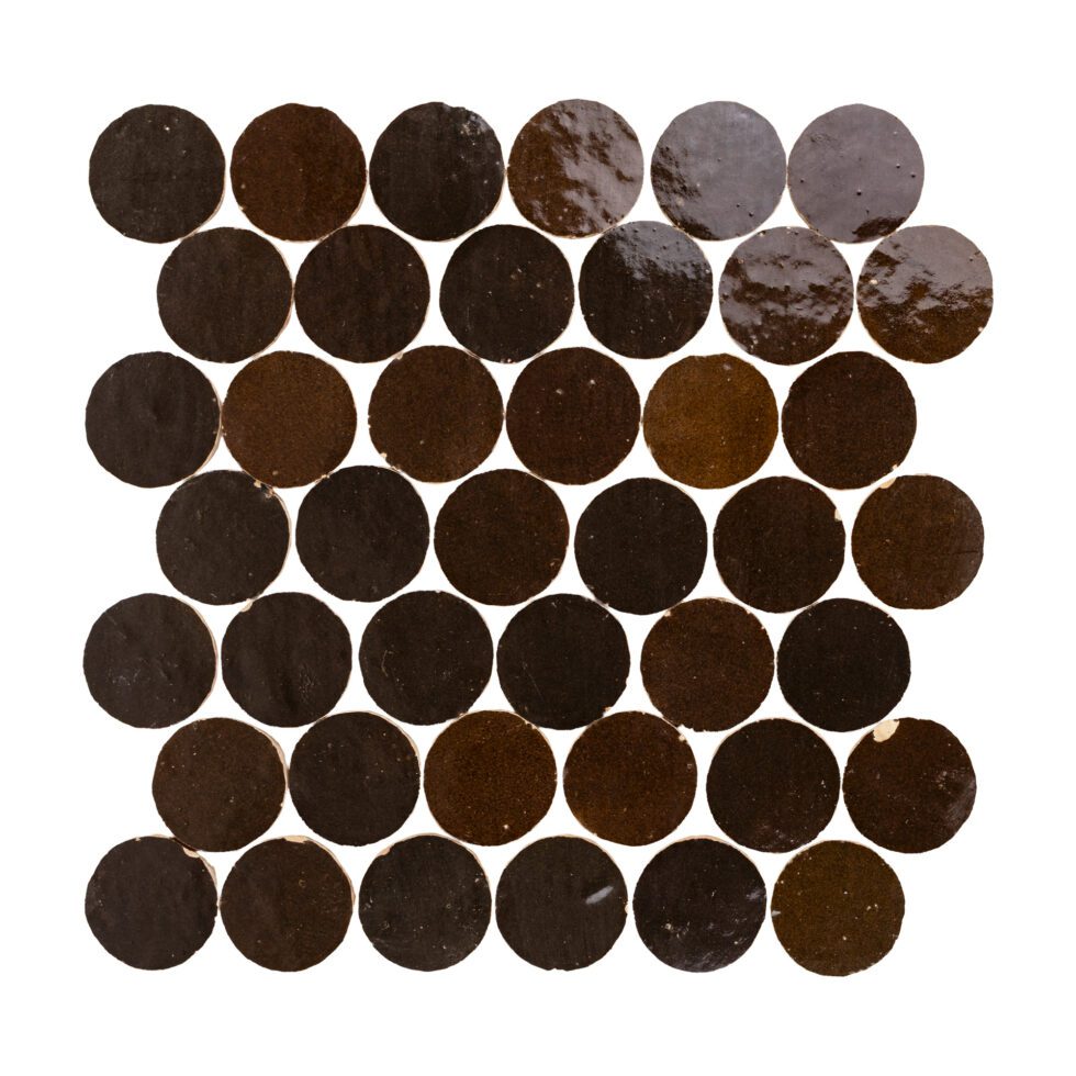 Zellige mosaic pattern of dark brown circular tiles on a white background