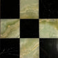 An intricate mix-and-match checkerboard pattern featuring Green Onyx and Nero Marquina tiles. The combination of the green stone’s natural veining and the black marble’s bold color creates a visually stunning design, ideal for modern interiors.