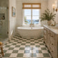 Noemie Checkerboard Zellige Tile installed in a bright European bathroom featuring Soft Sand and Ivory handcrafted Moroccan Zellige.