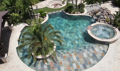 Fossil Pool Mix mosaic tile installed in a tropical villa swimming pool