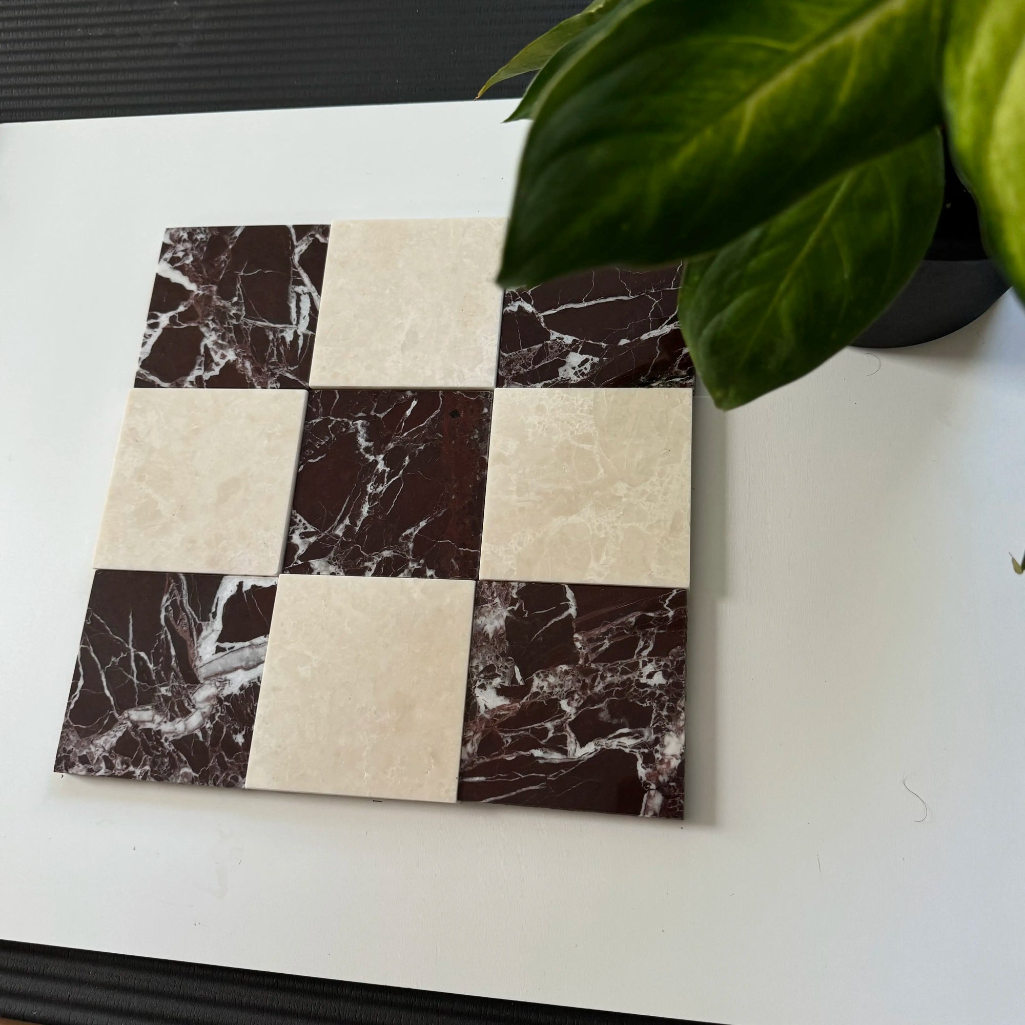 Checkerboard layout with Rosso Levanto marble and milky white marble tiles. The deep red veins of the Rosso Levanto contrast elegantly with the soft beige tone of the white marble.