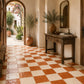 Solenne Checkerboard Zellige Tile installed in a Mediterranean-inspired entryway featuring Terracotta and Ivory handcrafted Moroccan Zellige.