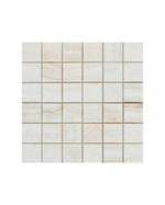 Square 2 inch by 2 inch vein-cut mosaic tile sheet in soft beige onyx, featuring a grid layout of small square tiles with natural, gentle veining.