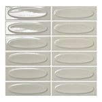Vellora Linen Mist 2×6 oval porcelain mosaic sheet with a glossy warm-neutral dimensional finish
