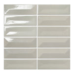 Vellora Linen Mist 2×6 porcelain mosaic sheet with randomly arranged glossy raised and recessed pieces
