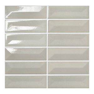 Vellora Linen Mist 2×6 porcelain mosaic sheet with randomly arranged glossy raised and recessed pieces
