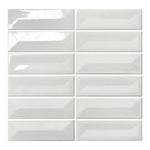 Vellora Pearl White 2×6 porcelain mosaic sheet with randomly arranged glossy raised and recessed pieces
