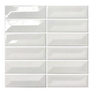 Vellora Pearl White 2×6 porcelain mosaic sheet with randomly arranged glossy raised and recessed pieces
