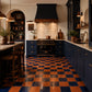 Vivienne Checkerboard Zellige Tile installed in a luxury kitchen featuring Indigo and Terracotta handcrafted Moroccan Zellige.